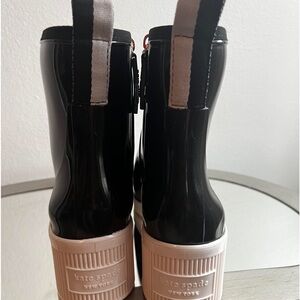Authentic -Kate Spade black-rubber, side zippers , new without tags.